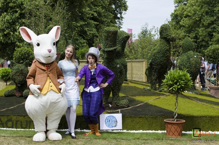 Alice Characters in front of Topiary